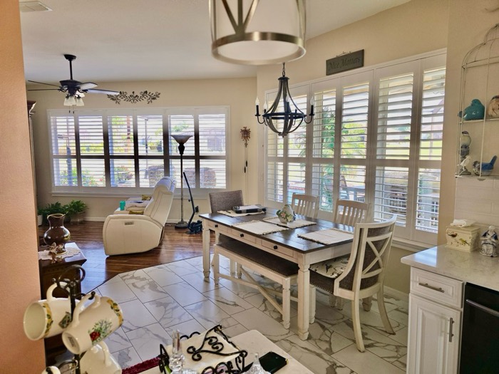 Plantation shutters throughout an open-concept kitchen and living room